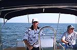 Jack Barnes from Ocean Pines enjoys a turn at the helm aboard a Hunter 44 while sailing the Chesapeake with fellow Piner Dr John Bower along with 3 other chartered boats.