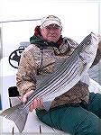 Bob Blatchley with a very nice striped bass caught off the coast on 12/10/2007. Fish hit a white biucktail tipped with yellow plastic.