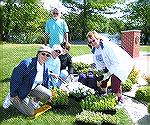 Photo shows volunteers from the Ocean Pines Garden Club planting flowers at the site of the Worcester County Veterans Memorial in Ocean Pines. The Ocean Pines Garden Club has maintained special garden