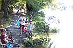 A few of the 102 participants line the South pond in the annual Ocean Pines Anglers Club, Kids Fishing Contest.