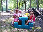 Ava and Frank Usavage [L] share a picnic table with Julia Carson at the first combined picnic of the Ocean Pines Anglers Club and the Maryland Saltwater Sportfishermen's Association.