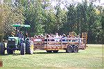 Youngsters get a taste of the good old days as they enjoy a hayride at the Community Church's Fall Festival.