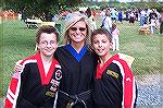 Kim Heaney, owner of Chesapeake Martial Arts strikes a pose with students Kevin O'Connor [L] and hunter Dortenzo at the Community Church's Fall Festival.