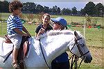 Jake Banks enjoys a pony ride at the Community Churches Fall Festival
