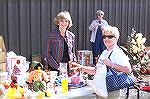 Ministers wife Karen McKelvey [L] offers Sid Warner a variety of items from which to select at the Community Church's Fall Festival.