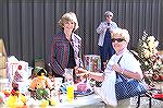 Ministers wife Karen McKelvey [L] offers Sid Warner a variety of items from which to select at the Community Church's Fall Festival.