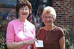 Sue Coleburn, organizer of the Baking Contest, presents first place award to Maryanne Jensen winner of the cake division. 
Sue herself took first place in the pie division.
First place in the cookie