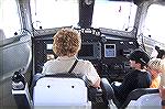 Andrea Barnes tries out the coxswains chair at the helm of the Coast Guards rescue boat during Harbor Day in W. Ocean City