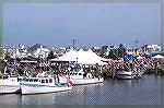 A view across the channel from Captains Galley restaurant at the crowd attending the first annual Harbor Day in W. Ocean City. The event offered insights into commercial fishing, water safety, fish pr
