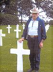 Roelof &quot;Dutch&quot; Oostveen stand by a serviceman's grave at The Netherlands American Cemetary. See article &quot;An outreach from the Netherlands&quot; from the November 5, 2008 edition of The 