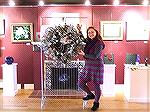 Anna Mullis, executive director of the Worcester County Arts Council shows off one of the wreaths that will be part of a silent auction on November 28 at the Art Gallery in Berlin. Proceeds of the auc