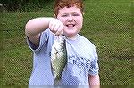 Ian Frazier from Ocean Pines shows off his nice size Crappie caught in the south pond at the Ocean Pines Anglers Club 2009 Teach A Kid To Fish event. Obviously Ian listened well. 