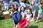 3 young female anglers display the prizes that were awarded to all young anglers at the Ocean Pines Anglers Club Kids Fishing Contest. In this event no one goes home empty handed.