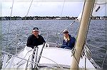 Ryan Sterba shows Al Todd some tips on how to win a sailboat race when beating across the St Martins River in Als 23' O'Day sailboat. Al,who has sailed extensively, along with Jack Barnes took Ryan, w