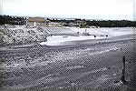 storm damage.  Shot from dunes towards the NEW parking area.