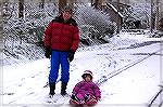 Steve Pivec and his daughter Elizabeth take advantage of the first snowfall in Ocean Pines in 2010.