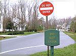 Carrollton Lane showing "Do Not Enter" signs at intersection with Yacht Club Drive.