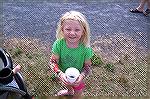 Young angler gets ready to fish after obtaining her cup of worms at Anglers Club Teach A Kid To Fish event.