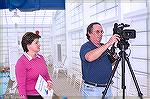 Public relations director and Dave Schwarten do video at the Ocean Pines indoor pool grand opening in 2007.