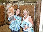 Andrea Barnes makes new friend Nancy and her horse North Star, a  Haflinger breed, who took first place in his class at the Delaware State Fair.