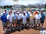 Captains who volunteer their time to take out Believe In Tomorrow Families [children with life threatening illnesses] fishing and sightseeing in our local bays. 
;  Front L to R,  Dick Elliott, Norm 