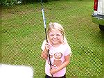 Young Angler is happy winner of rod and reel at 18th annual Art Hansen memorial fishing contest sponsored by Ocean Pines anglers Club.