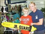 Carson Barnes completes Jr Lifeguard Day with instructor and Aquatics Director Colby Phillips.