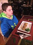 Our grandson enjoying Crab cakes