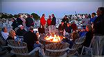 Some folks enjoying the warmth of the Ocean Pines Yacht Club  fire pit on a cool Memorial Day weekend evening.