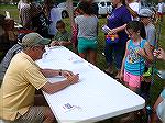 Bob Cooke and Buddy Siegel teach knot tying at Teach A Kid to Fish event.