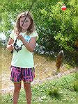 Trista catches nice fish at Teach A Kid to Fish event.