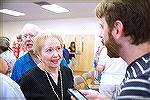 OPA Annual Meeting and board election. Cheryl Jacobs (center in black) is interviewed by Bayside Gazette reporter Josh Davis after election results showed she was one of two winning candidates for a s