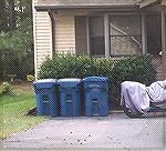 Trash cans are now stored in front of homes all over OP.