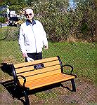 Bob Abele poses behind a bench dedicated in his honor on Ocean Parkway between Wood Duck 1 & Wood Duck 2 to the north of the mail boxes.

Bob Abele has been active in various OPA committees and orga