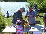 Anglers Club members Dave Rippy and Lee Phillips [event chairman] at tackle table with young angler Eden. 
The Ocean Pines Anglers Club hosted the annual Teach A Kid To Fish event on Saturday at the 