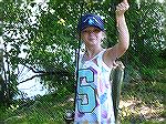 Sarah Lapointe shows her big Large Mouth Bass that measured over 15 inches caught during the Ocean Pines Anglers Club Youth Fishing Contest at the South Gate Pond.