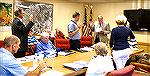 OPA attorney Joe Moore (paper in hand) administers the unrequired OPA board oath of office to new board members, (left to right) Slobodan Trendic, Brett Hill, and Pat Supik.