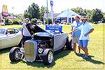 OPA Board member Slobodan Trendic points out some features of his "ride" during the Ocean Pines Chamber of Commerce car show on 8/28/2016.
