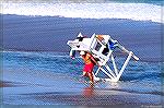 Ocean City Maryland lifeguard lugs stand back from rising tide.