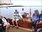 Tom Yenney takes the helm of the historic Cat Boat Selina II in St. Michaels.  