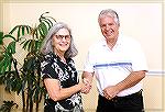 Colette Horn and Doug Parks congratulate each other after each was elected to a three-year term on the OPA Board of Directors.