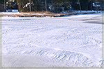 Snow ridges on frozen Manklin Creek.