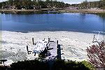 Spring in Ocean Pines, Maryland. Pine tree pollen covers everything. Yhis accumulation is on Manklin Creek after a calm night.