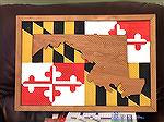 MD Map Flag that I recently finished.   The frame and the MD Map were made from scrap cherry wood I had bought with my father-in-law years ago.  The flag is a made from a scrap piece of MDF that I had