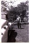 Jack Barnes Sr. washing his car sometime in the 40s.