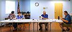 Election Committee does a manual count of returned ballots in board spending referendum.