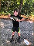 Anthony Giannotta shows his 17 &frac12;&rdquo; Bass which took 1st place for largest fish in the 8-11 age group in OPAC Art Hansen Youth Memorial Fishing Contest.