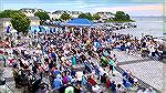 Yacht Club. Sunday evening. Labor Day weekend.  2021. One of the largest crowds ever. Dance area is empty as band just took a break. Cars parked all over the place. Saw very few folks I recognized in 