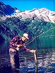 Joe Reynolds fishing for cutthroat trout in The Bob Marshall Wilderness Area in Montana. Image from an original Kodachrome slide, circa 1985. This was a small lake high in the mountains. Took a two-da