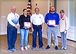 OPVFD President Dave Van Gasbeck presents the American Heart Association Heartsaver Hero Award to Rob Ruszin and Judie Scotti for saving the life of an Ocean Pines Clubhouse Grill customer. Left to ri